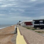 Sea wall and cabins